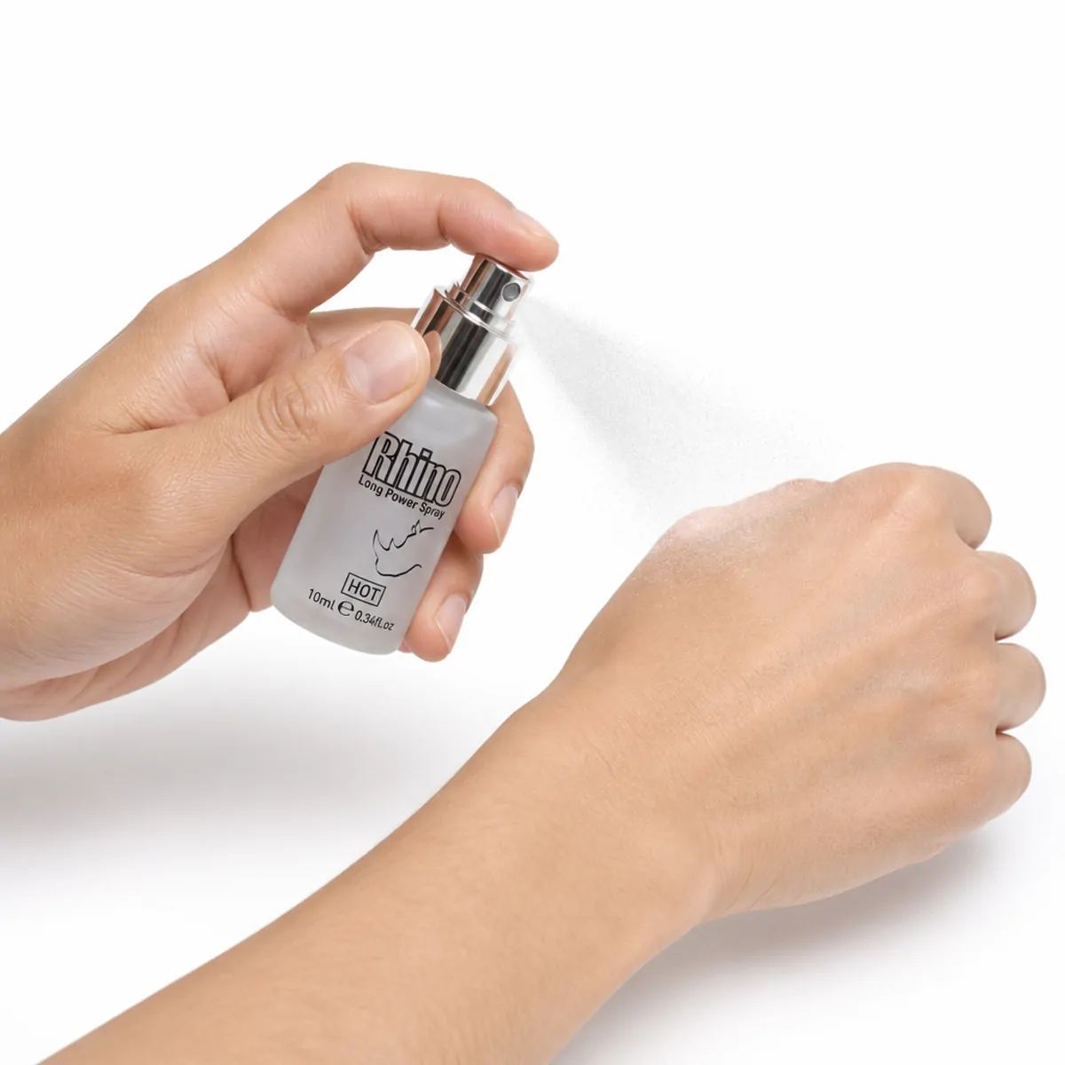 The 10 ml Rhino Long Power Spray bottle being pumped, releasing a fine mist onto the back of an open hand